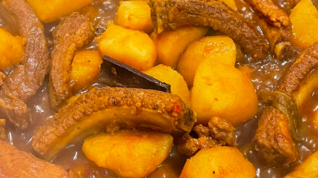 Traditional Chinese potato and rib stew, highlighting the cultural inspiration behind the “Little Potatoes” meme.