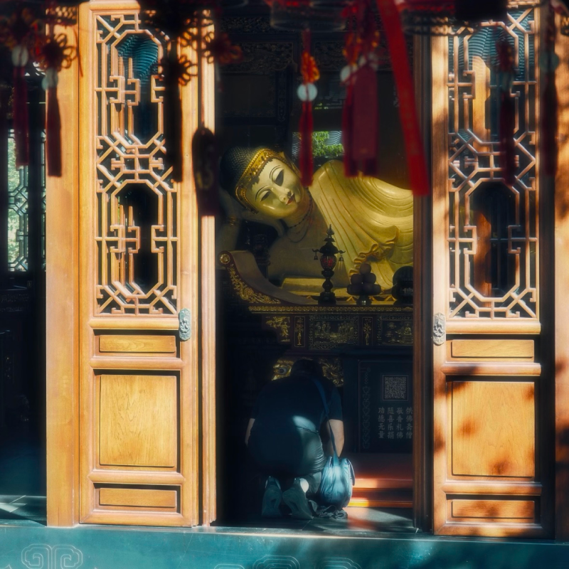 Reclining Buddha statue inside Jade Buddha Temple meditation hall in Shanghai