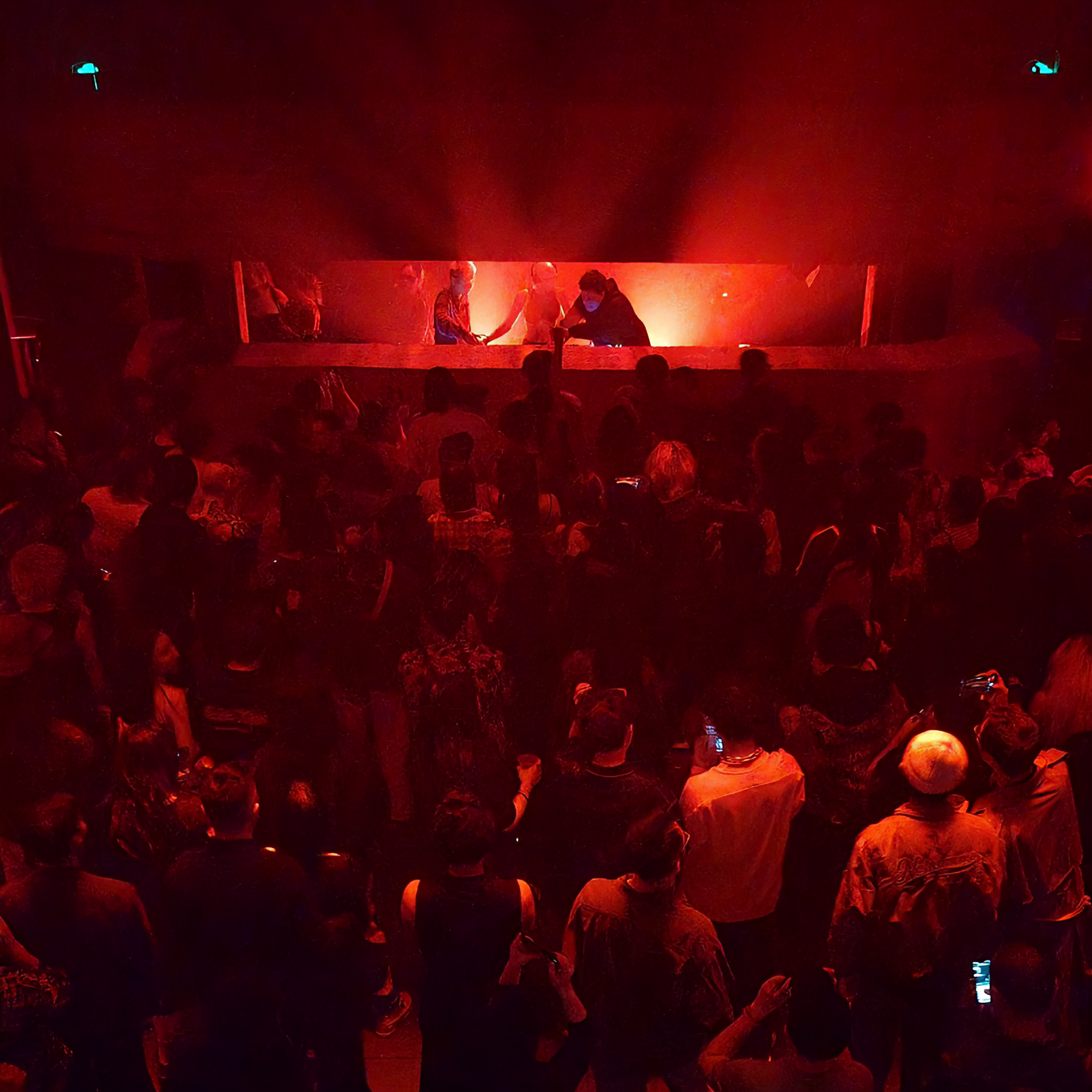 Crowd dancing and enjoying live DJ music at a vibrant nightclub in China.