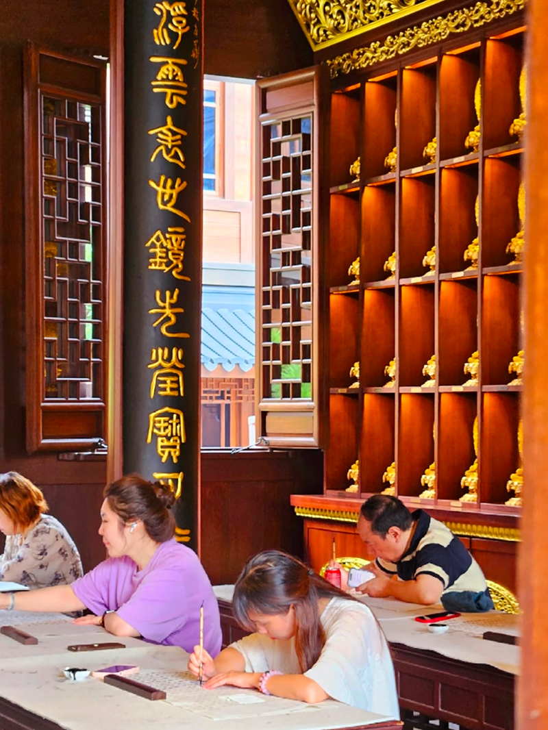 Hanzi calligraphy meditation session inside Jade Buddha Temple classroom