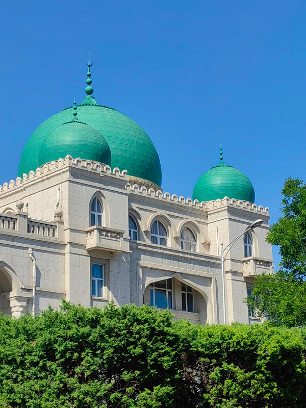 The iconic green domes of Niujie Mosque, the oldest and largest mosque in Beijing, symbolizing Islamic culture in China