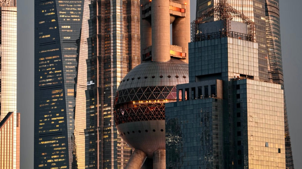 The Oriental Pearl Tower, a landmark of Shanghai, is sparkling in the sunlight.