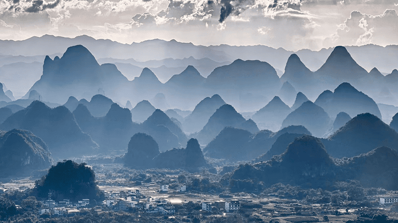 In Guilin, China, the iconic karst terrain is defined by its continuous, never-ending ridges.