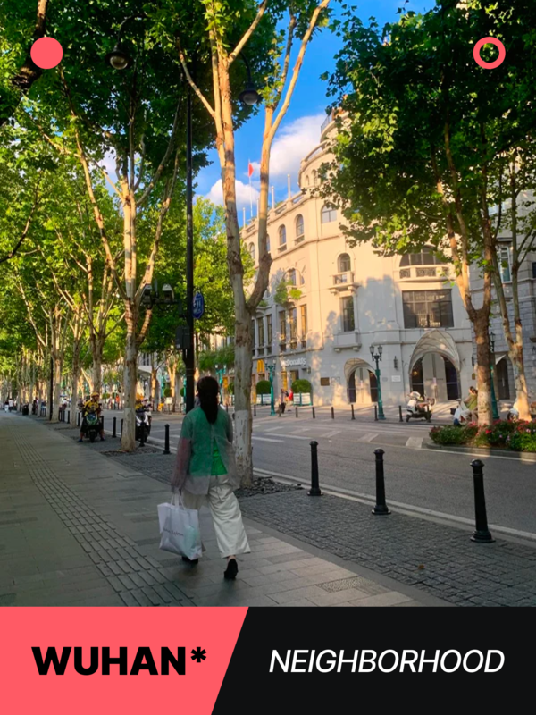 Woman strolling through a shaded, tree-lined avenue in Wuhan’s historic French Concession-style neighborhood during sunset