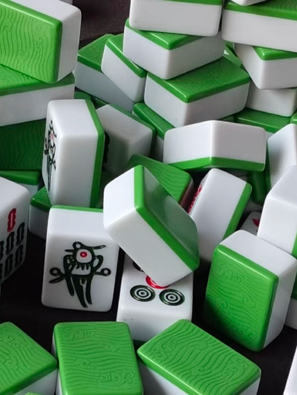 Stack of green-backed mahjong tiles in Chengdu, showcasing the colorful and tactile elements of traditional Chinese gameplay